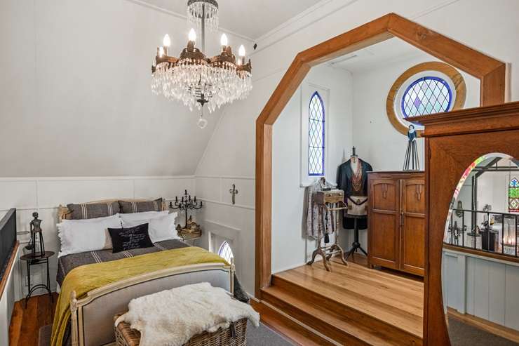 The heritage-protected 1889 church on School Road in Clive has been lovingly converted into a modern two-bedroom home. Photo / Supplied