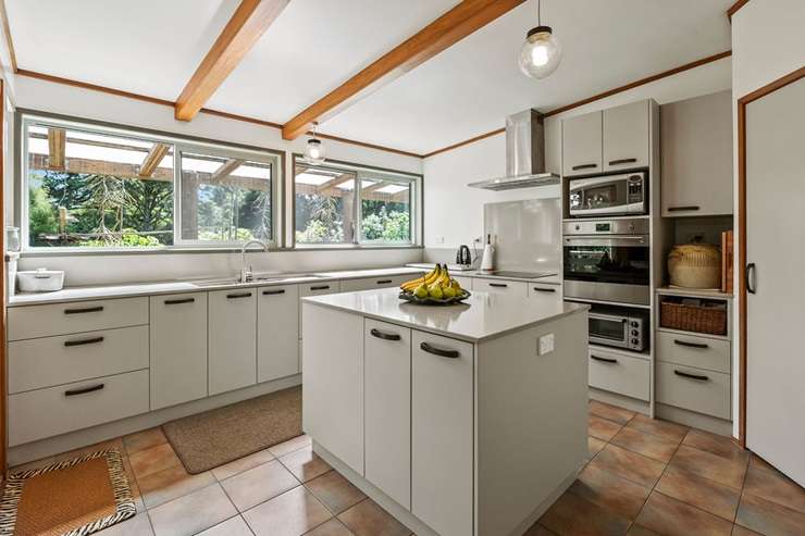 David and Linda Muir are selling their three-bedroom, two-bathroom log cabin near Kamo, Whangārei after 23 years. Photo / Supplied