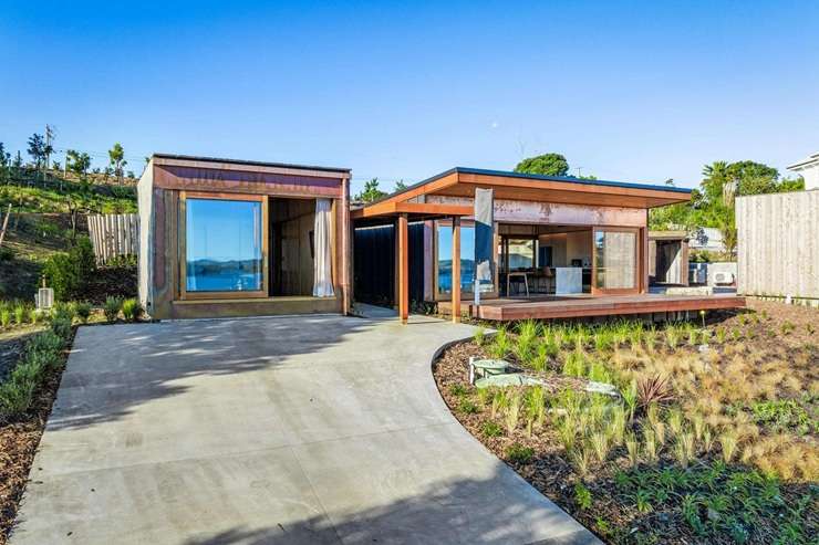 The four-bedroom waterfront home on Young Street, in Mahurangi East, attracted a lot of interest from Auckland buyers. Photo / Supplied