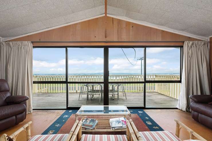 A classic 1960s bach on Broadway Road, in Waihi Beach, sold in a competitive auction for <img.855m. Photo / Supplied