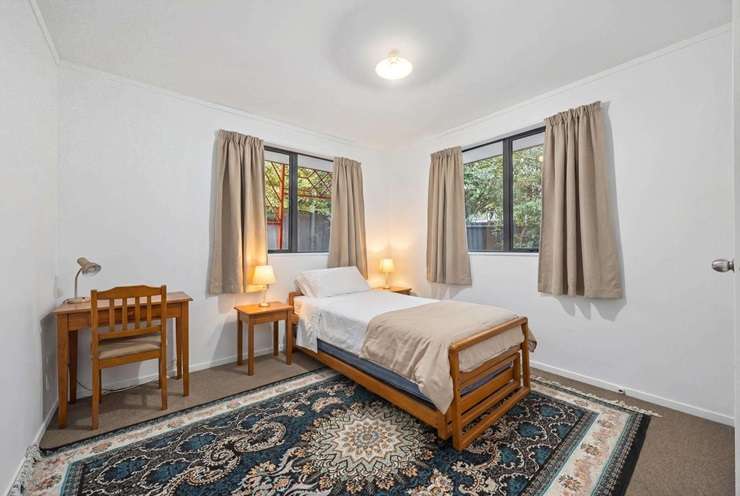 The four-bedroom home at 29 Woodbank Drive, Glen Eden, is listed with a Ray White agent who has a track record of beating the bank. Photo / Supplied