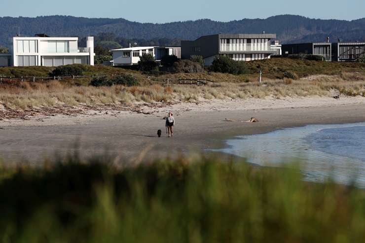 OneRoof is given a tour of a beach-front bach that's quietly on the market with Precision Real estate agent Di Balich. Video / Fiona Goodall