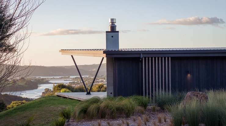 Simon Dickey created his modern masterpiece at 215B Benseman Road, in Raglan, to capture the sunrises and sunsets. Photo / Supplied