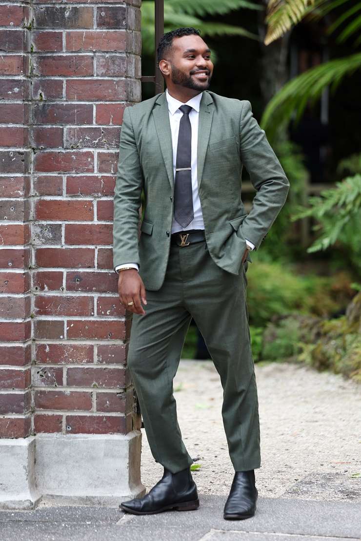 Barfoot & Thompson agent Paul Neshausen is wearing a Dolce & Gabbana sequin suit, a Versace shirt and Gucci shoes. Photo / Fiona Goodall