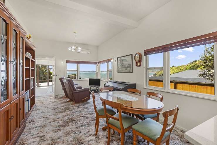 The two-bedroom Wainui Road home, which is one of 10 properties in sought-after Whale Bay, sold for $3m plus. Photo / Supplied