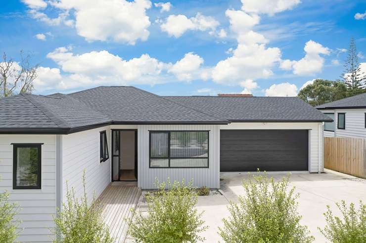 Ray White agent Nadia Johnston breathes a sigh of relief as she gets a sold sticker on one of the four properties she had sold by the end of last week. Photo / Supplied