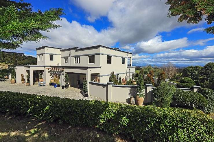 The 1950s arts and crafts property with stunning park-like gardens is on the market after decades of hard work. Photo / Supplied