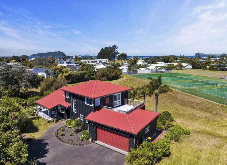 An absolute beachfront home at 22 McCall Avenue, in Pauanui, is one of dozens of Coromandel homes to hit the market recently. Photo / Supplied