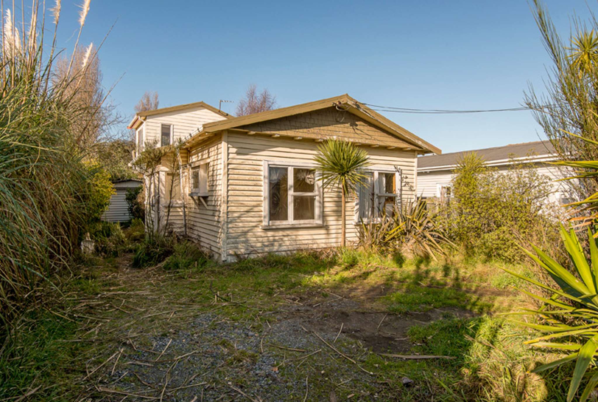 Do up or blow up? ‘Untouched’ Christchurch original sells for super-cheap $235,000