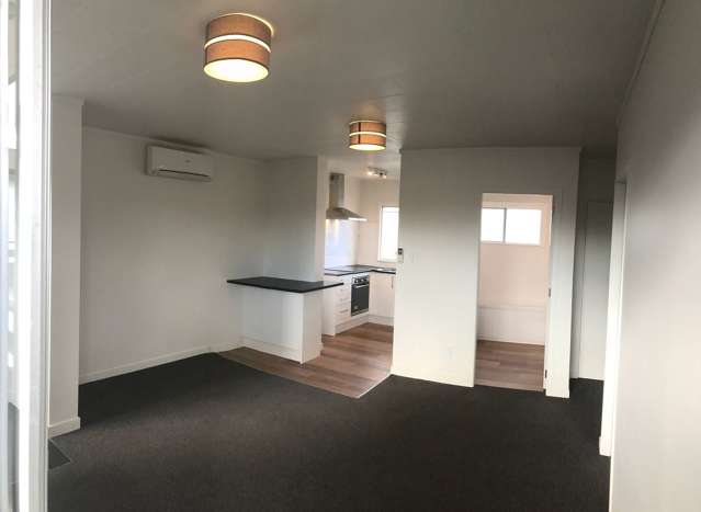 Bright Upstairs Two-Bedroom Unit –  Handy Location