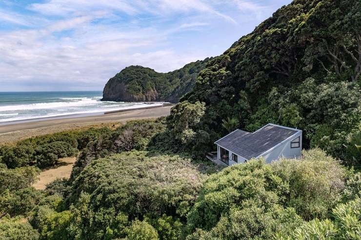 36 Piha Road seems to float above Piha's iconic coastline. It's on the market for $2.985 million. Photo / Supplied