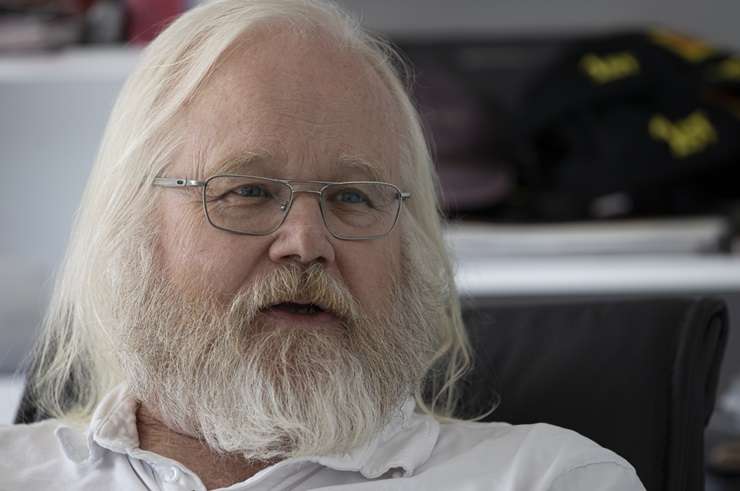 IT tycoon David Dicker, with his GP2 racing car in 2016, is quitting the hospitality business. Photo / Supplied