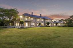 Racing duo’s extra-large manor for sale - comes with indoor climbing wall and 18-car garage