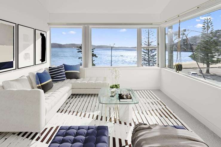 The villa at 186 Oriental Parade, in Oriental Bay, is for sale by negotiation. Owners Liz Aitken and Rob Morgan commissioned the eye-catching mural that faces the street. Photo / Supplied