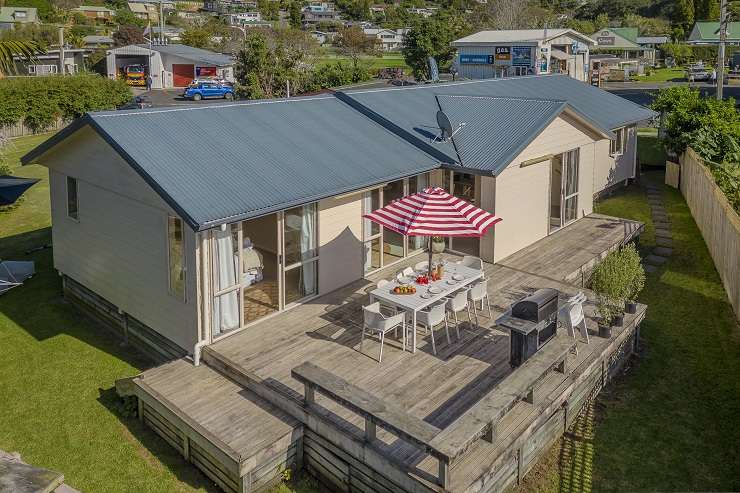 A three-bedroom, two-bathroom bach on Vista Paku, in Pauanui, received multiple offers after a busy open at the weekend. Photo / Supplied