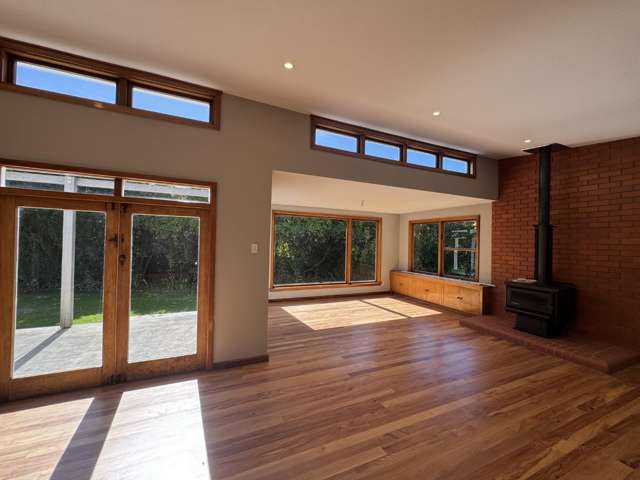 Your Private Sanctuary: Mid-Century Charm and Stunning Natural Light