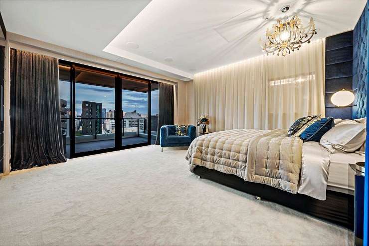 The opulent apartment cost $2m to fit out. It includes a curtain portrait of designer Karl Lagerfeld. Photo / Supplied