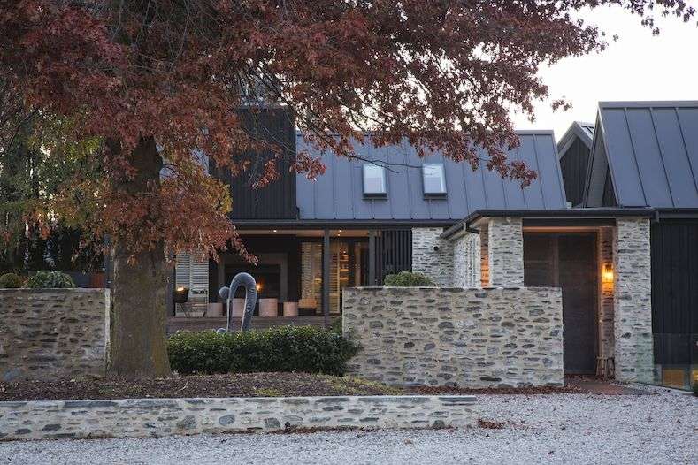 glass and stone luxury lodge above Lake Wakatipu Queenstown