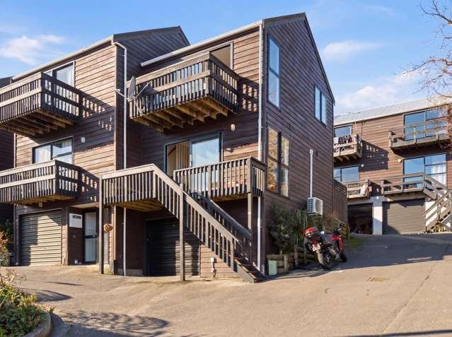 SUN-DRENCHED CORNER TOWNHOUSE WITH GARAGE
