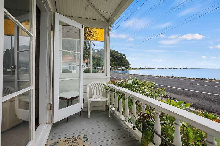 The 100-year-old cottage at 543 Tararu Road is to be auctioned with an advertised reserve of $380,000, which is <img5,000 less than its land value. Photo / Supplied