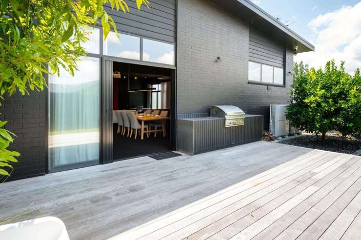 The black shed with a studio-style living area on Horsham Downs Road, Rototuna North, in Hamilton, sold to someone who plans to live in it as is. Photo / Supplied