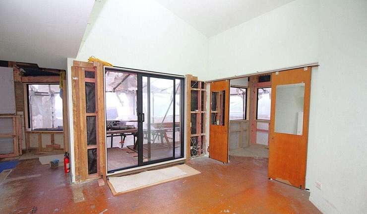 The three-bedroom home for sale at 131 Victory Road, in Laingholm, West Auckland, has been pitched to developers and builders. Photo / Supplied