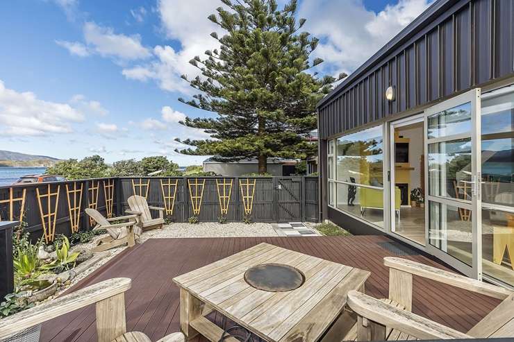 A three-bedroom beach retreat for sale at Breaker Bay makes the most of the view. Photo / Supplied