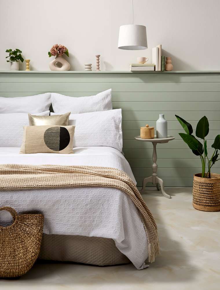 A contrast pattern and depth of colour bring rich warmth to this room that still feels inspired by the coast. Project by Annick Larkin. Mural Hannah Tapner.  Photo / Bryce Carleton