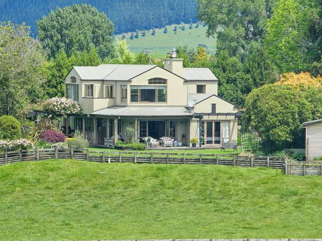 Beautiful home, stunning setting, large sheds