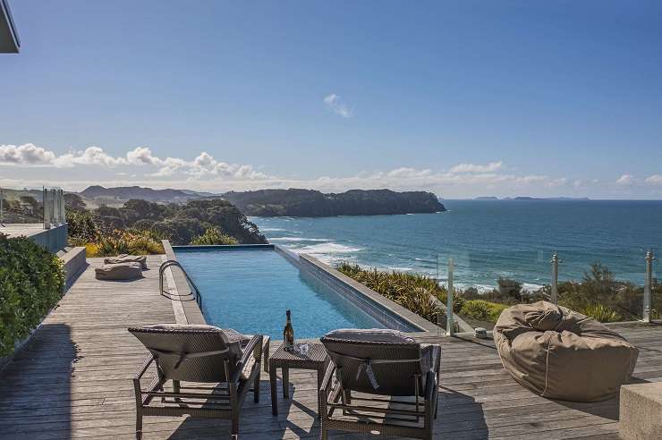 A luxury five-bedroom, six-bathroom home which overlooks Hot Water Beach in the Coromandel is going to auction on June 6. Photo / Supplied