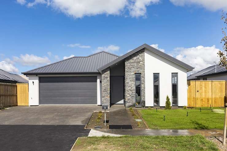 Houses under construction in Westgate, Auckland. The suburb is one of several that have seen a surge in new home listings. Photo / Alex Burton