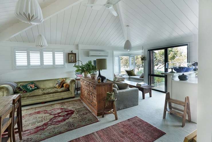 The four-bedroom beach home at 18 Matakatia Parade, in Matakatia, Auckland, is up for grabs. Photo / Supplied