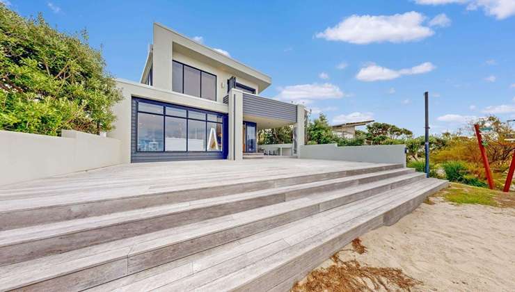 A concrete and glass beach home at Beverley Terrace, in Whangamatā, sold in December. It had a RV of $6.45m. Photo / Supplied