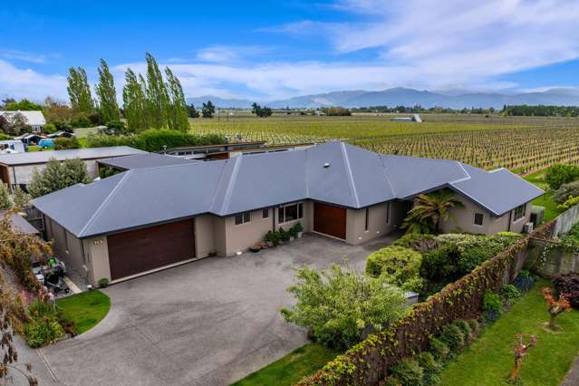 Rural views with triple car garaging