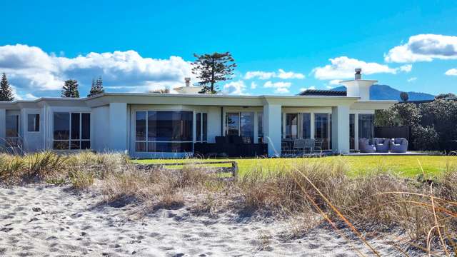 Sir John Key’s former beach house up for grabs