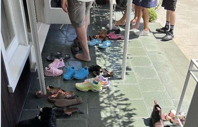 Shoes pile up as buyers crowd house that last sold 30 years ago