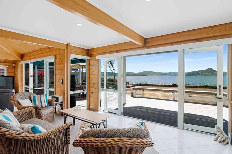 A five-bedroom home on the waterfront at Cooks Beach is on the market for sale. Photo / Supplied