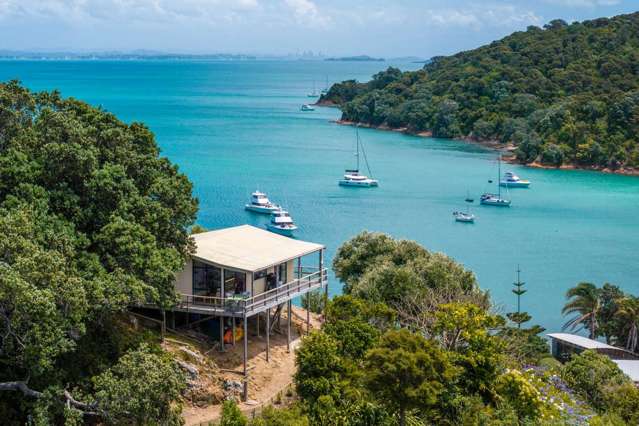 Simple bach on Waiheke ridge for sale with mooring and furniture included