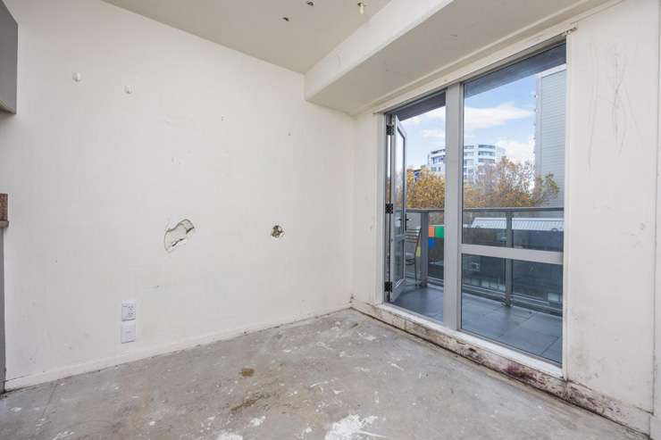 This one-bedroom apartment at 5B/113 Vincent Street, in Auckland CBD, has holes in the wall