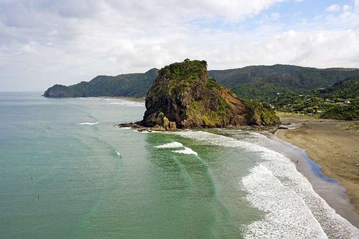 Landslides in Muriwai, caused by Cyclone Gabrielle, have ripped the beach suburb apart. Photo / Getty Image