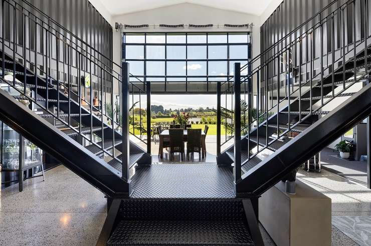 The five-bedroom, three-bathroom home on Ranby Road, in Ohaupo, was built using 12 steel shipping containers. Photo / Supplied