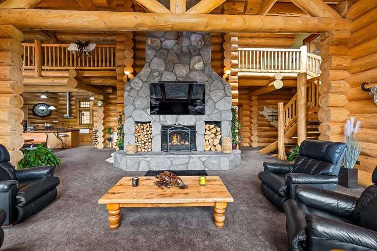 A six-bedroom log home built in Canada and now located in Ōkaihau in the Far North has an asking price of $2.55m. Photo / Supplied