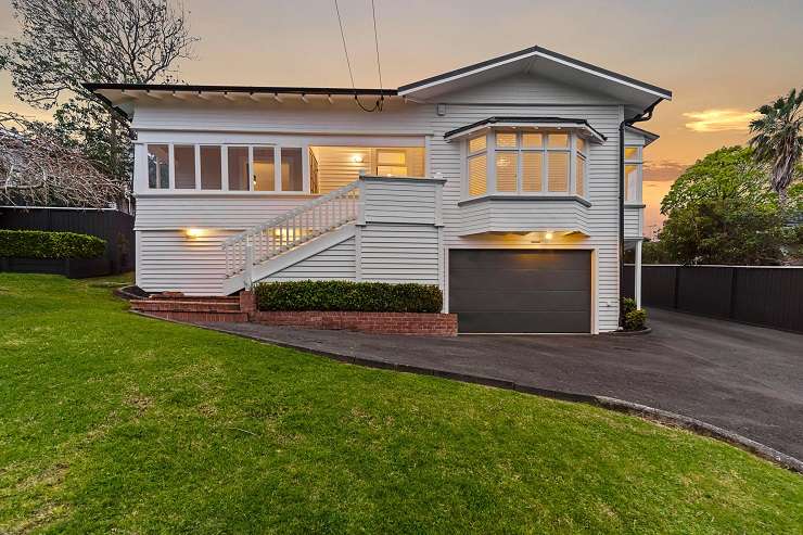 modern house and decking overlooking lawn and water  251 Omaha Drive, Omaha, Auckland