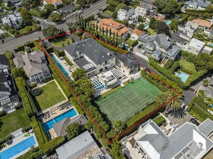 White tuscan-style mansion with cypress trees, lawn and clipped hedges 120 Victoria Avenue, Remuera