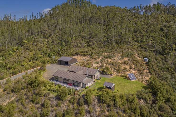 The off-grid home at 1409 Tairua-Whitianga Road, in Whenuakite, is on a large 26.3ha site, which is also home to at least half a dozen Kiwi. Photo / Supplied