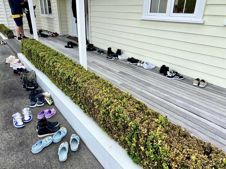 Cars lined the street outside 29 Puriri Road at last weekend's special open home for the property. Photo / Supplied