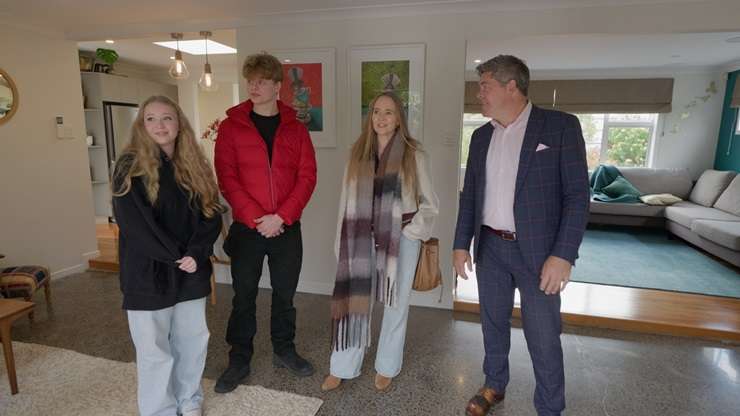 The host with the most dad jokes: Paul with house-hunter Rachel and her children. Photo / Supplied