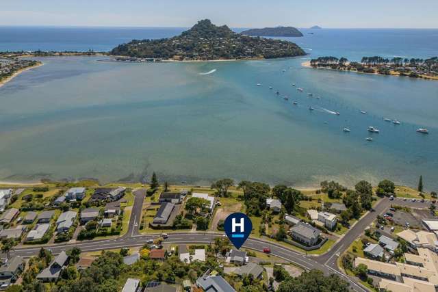 Location, Sun & 180 Degree Water Views!