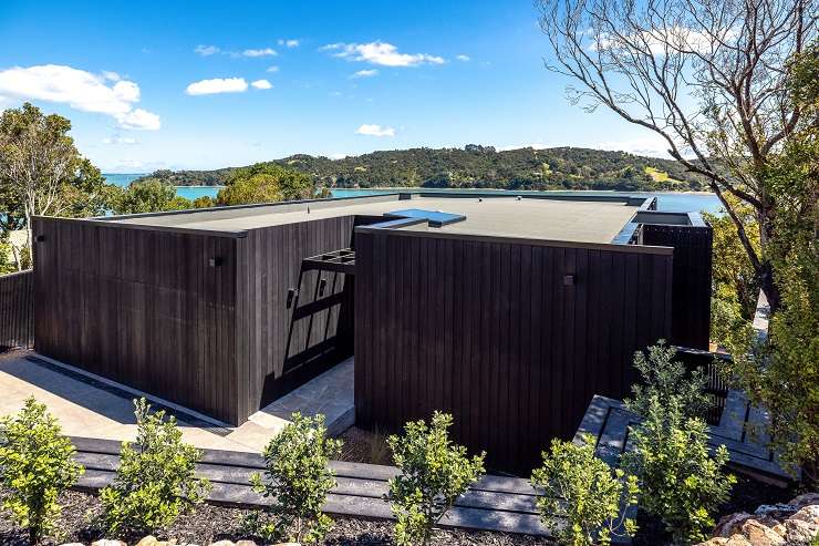 Construction work on a beach-front property on Miro Road, at Waiheke Island's Palm Beach. The 858sqm property was bought in 2020 for <img.22m. Photo / Supplied