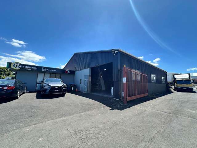 TWO WAREHOUSES, SHOWROOM, AND LARGE YARD